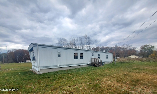 rear view of house with a lawn