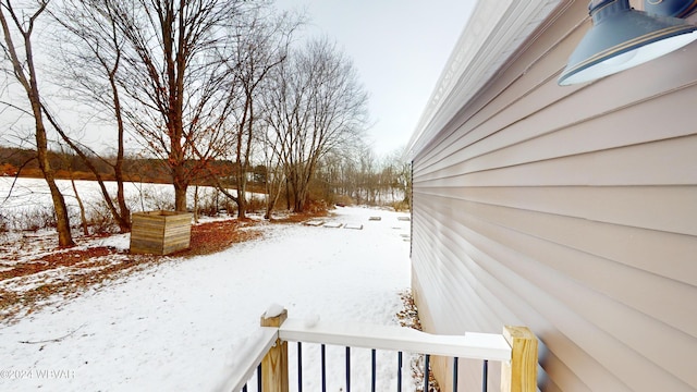 view of yard layered in snow