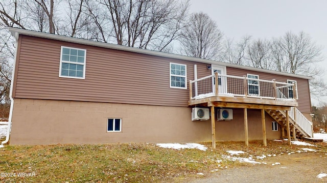 back of house featuring a deck