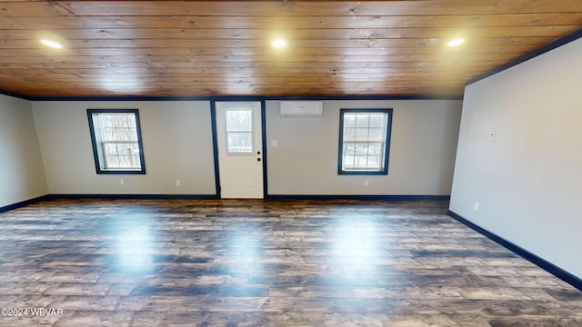 unfurnished room with a wall unit AC, dark wood-type flooring, and wooden ceiling