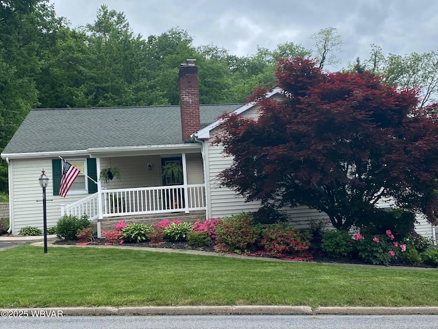 102 Hill St, Lock Haven, PA 17745 - view of front of property featuring covered porch, a front lawn, a chimney, and roof with shingles