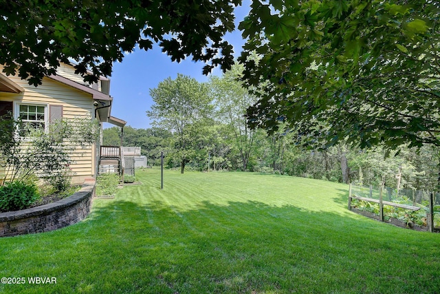 43 Hillcrest Ln, Williamsport, PA 17701 - view of green lawn with a vegetable garden and a wooden deck