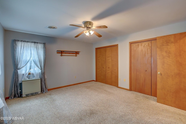 43 Hillcrest Ln, Williamsport, PA 17701 - unfurnished bedroom featuring multiple closets, carpet floors, and ceiling fan