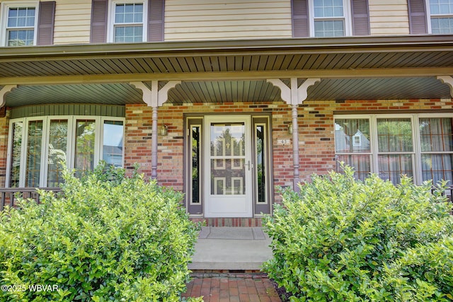 43 Hillcrest Ln, Williamsport, PA 17701 - view of exterior entry featuring covered porch and brick siding