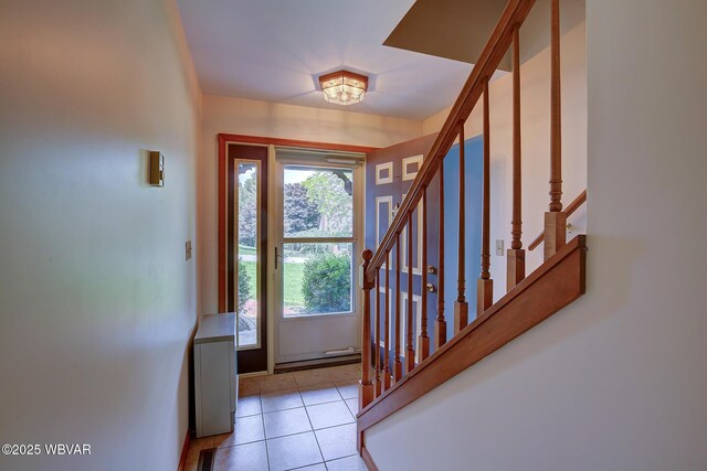 43 Hillcrest Ln, Williamsport, PA 17701 - entryway featuring stairway, light tile patterned flooring, and a baseboard heating unit