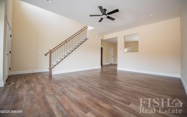 unfurnished living room featuring recessed lighting, ceiling fan, wood finished floors, baseboards, and stairs