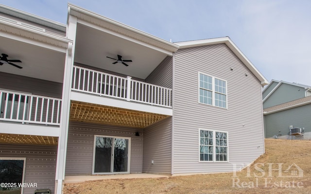 back of property featuring ceiling fan, cooling unit, and a balcony