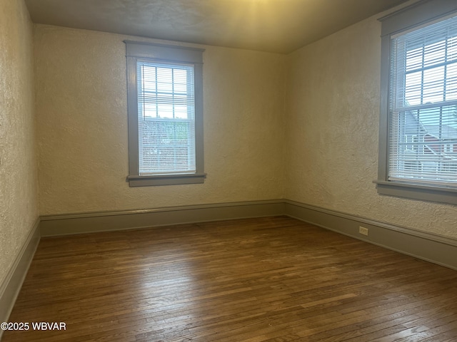 2401 Linn St, Williamsport, PA 17701 - spare room with baseboards, hardwood / wood-style floors, and a textured wall