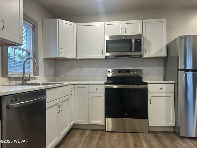 2401 Linn St, Williamsport, PA 17701 - kitchen featuring white cabinets, light countertops, stainless steel appliances, and a sink