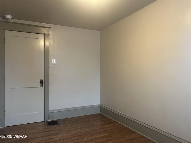 2401 Linn St, Williamsport, PA 17701 - spare room featuring dark wood finished floors, visible vents, and baseboards