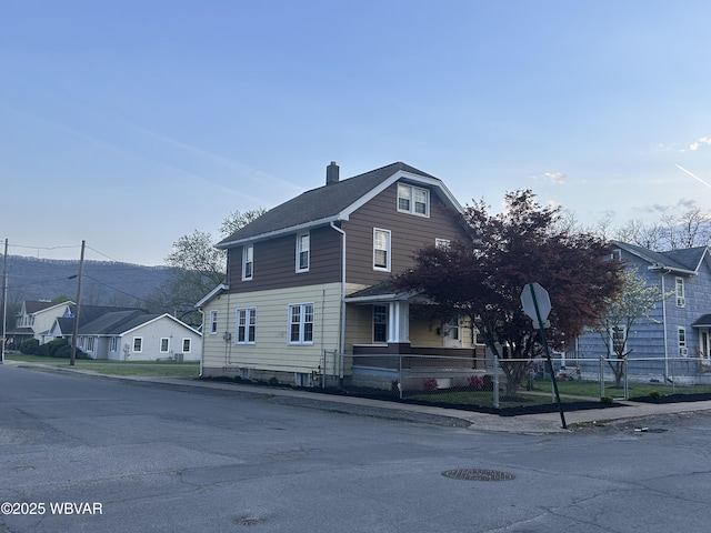 2401 Linn St, Williamsport, PA 17701 - view of front of property featuring a chimney, covered porch, and fence private yard