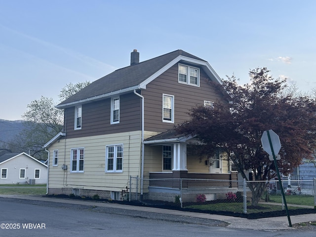 2401 Linn St, Williamsport, PA 17701 - view of front facade featuring a fenced front yard, a porch, and a chimney