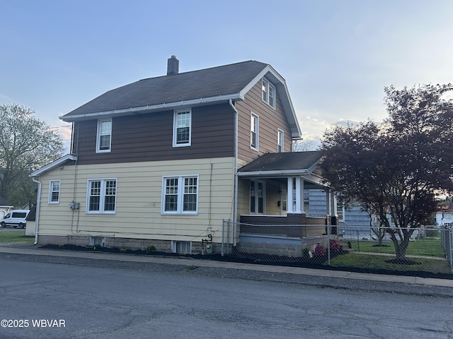 2401 Linn St, Williamsport, PA 17701 - view of home's exterior featuring a fenced front yard and a chimney