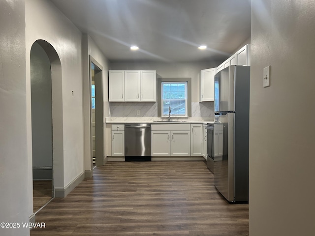 2401 Linn St, Williamsport, PA 17701 - kitchen featuring a sink, white cabinetry, appliances with stainless steel finishes, tasteful backsplash, and recessed lighting