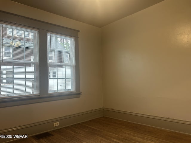 2401 Linn St, Williamsport, PA 17701 - empty room featuring visible vents, dark wood-style flooring, and baseboards