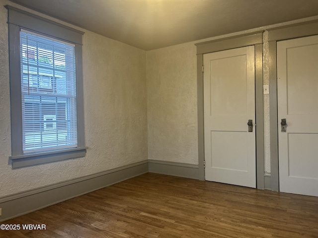 2401 Linn St, Williamsport, PA 17701 - spare room featuring a textured wall and wood finished floors