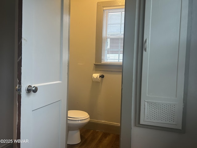 2401 Linn St, Williamsport, PA 17701 - bathroom featuring toilet, baseboards, and wood finished floors