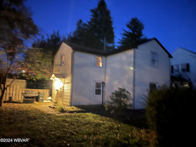 view of property exterior at night