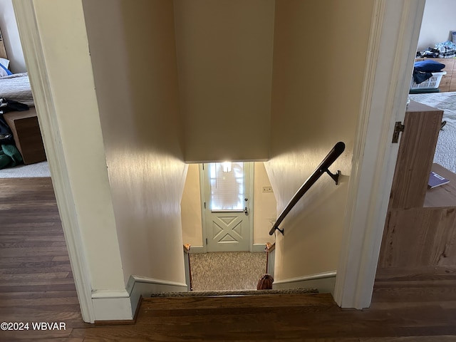 stairway featuring hardwood / wood-style flooring