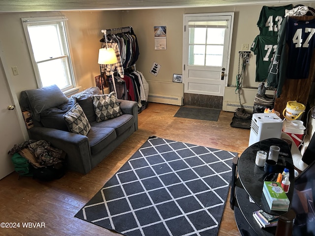 living room with hardwood / wood-style flooring and baseboard heating