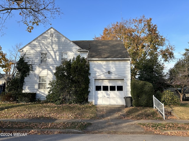 view of property exterior with a garage