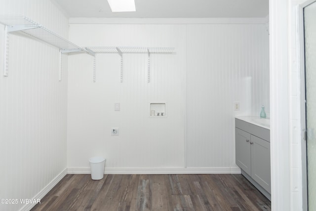 laundry room with hookup for a washing machine, crown molding, electric dryer hookup, and dark hardwood / wood-style floors