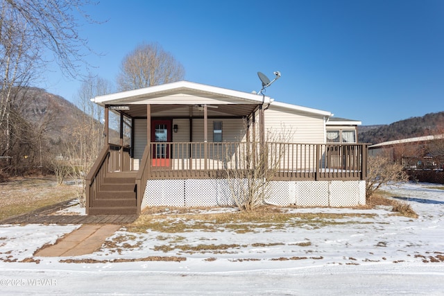 view of front of house with a mountain view and covered porch