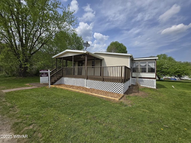 140 Bittners Park Rd, Trout Run, PA 17771 - view of front facade featuring a front yard and a sunroom