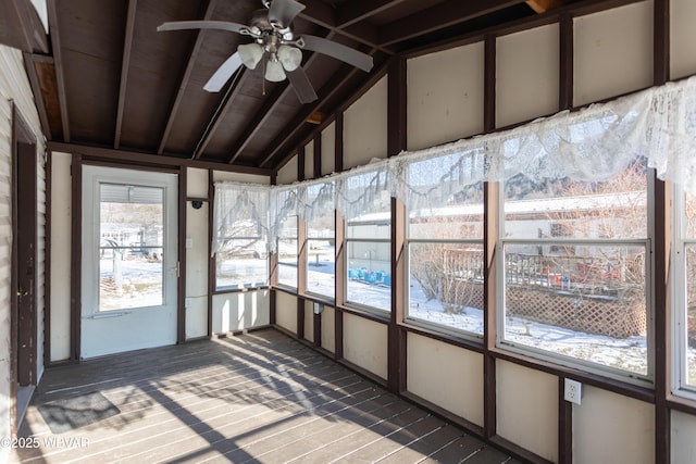 unfurnished sunroom featuring lofted ceiling and ceiling fan