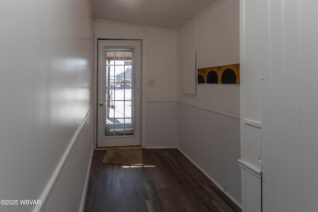 entryway with crown molding, lofted ceiling, and dark hardwood / wood-style floors