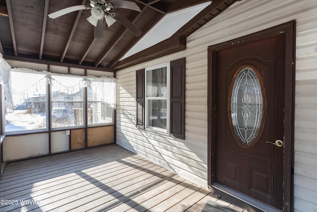 doorway to property with ceiling fan