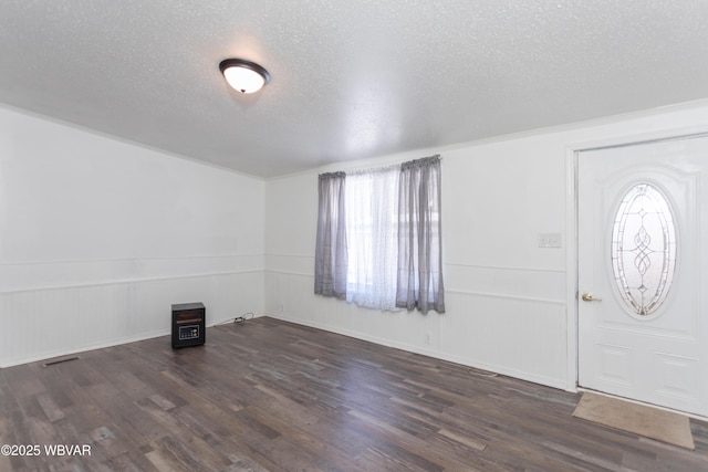 entryway featuring dark hardwood / wood-style floors and a textured ceiling