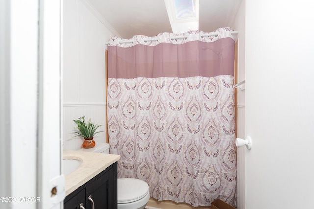 bathroom featuring vanity, curtained shower, crown molding, and toilet