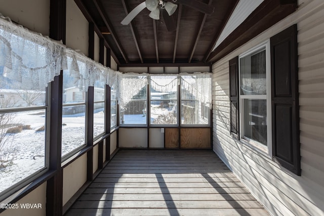 unfurnished sunroom featuring lofted ceiling with beams, ceiling fan, and wood ceiling