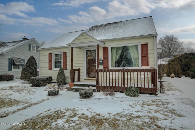 bungalow-style house featuring roof with shingles