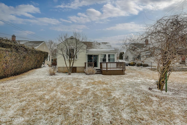 rear view of property with roof with shingles