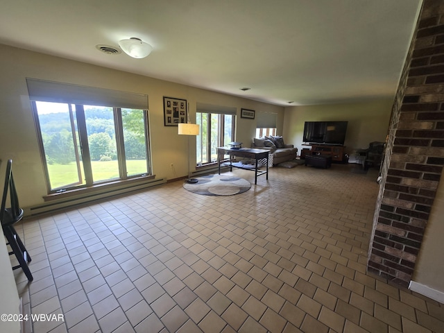 tiled living room featuring a baseboard radiator