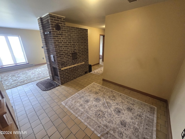 unfurnished living room featuring light tile patterned floors