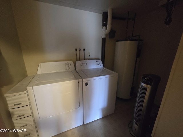 washroom with gas water heater and independent washer and dryer