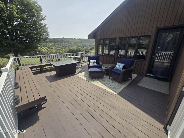 wooden deck with outdoor lounge area