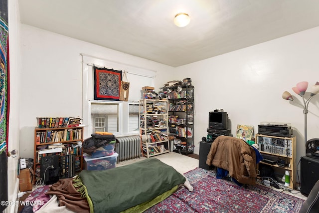 bedroom featuring radiator heating unit
