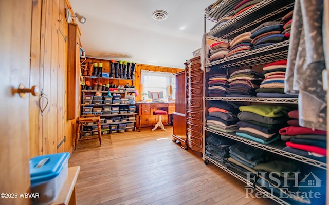 walk in closet with visible vents and wood-type flooring