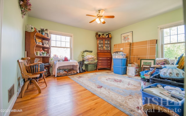 interior space with visible vents and ceiling fan