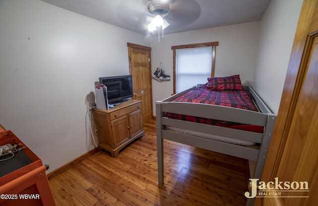 bedroom featuring ceiling fan and light wood-type flooring