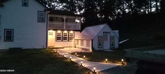 back of house with a balcony