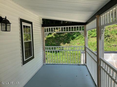 unfurnished sunroom featuring a wealth of natural light