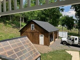 view of side of property featuring an outdoor structure