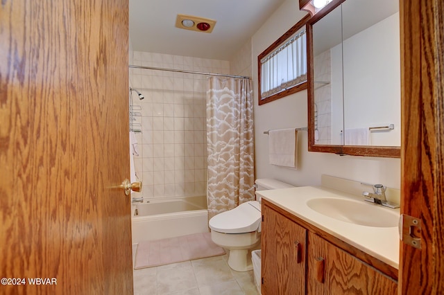 full bathroom featuring shower / bath combo with shower curtain, tile patterned flooring, vanity, and toilet