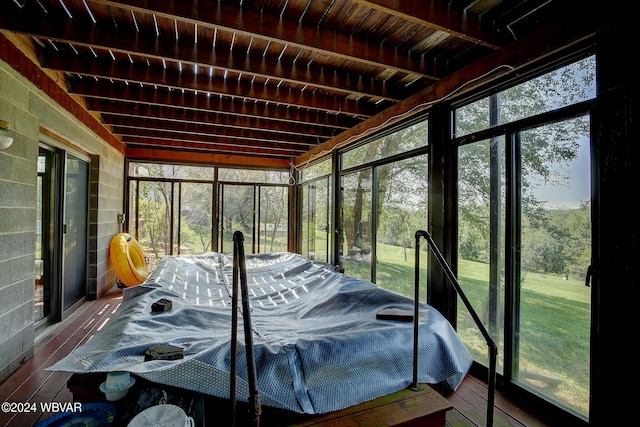 sunroom / solarium with beam ceiling and wood ceiling