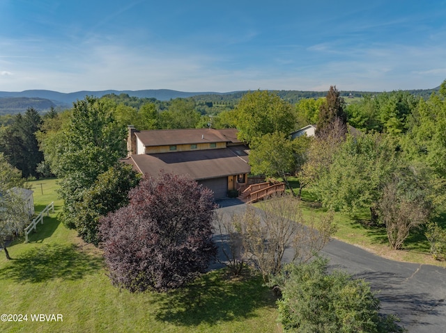 birds eye view of property featuring a mountain view